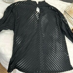 Black long sleeve shirt with button on back